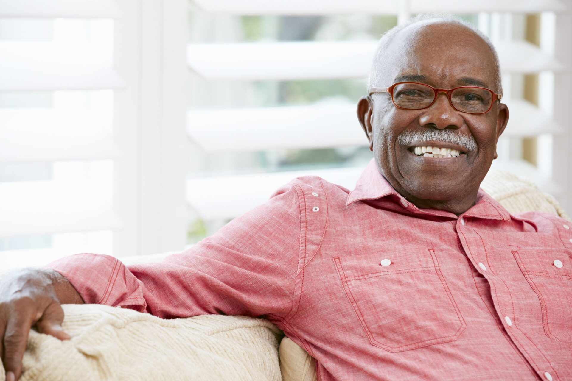 portrait of happy senior man at home